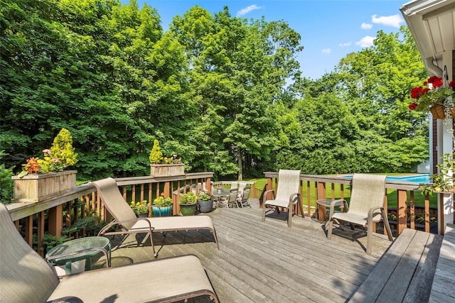 8 Braemer Rd, East Setauket, NY 11733 - wooden deck featuring outdoor dining area and an outdoor pool