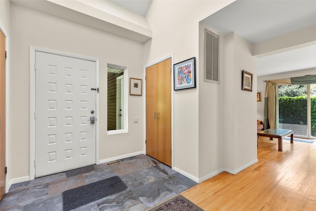 8 Braemer Rd, East Setauket, NY 11733 - entrance foyer featuring baseboards and stone finish flooring