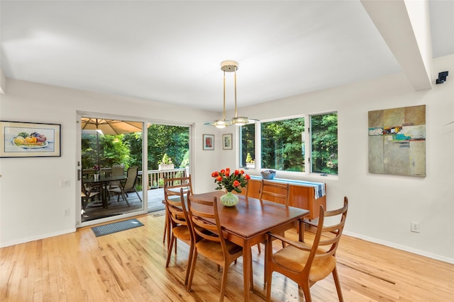 8 Braemer Rd, East Setauket, NY 11733 - dining space featuring light wood-type flooring and baseboards