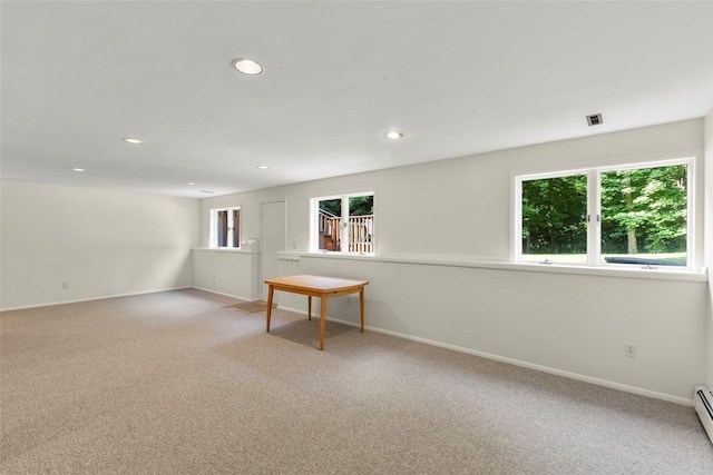 8 Braemer Rd, East Setauket, NY 11733 - unfurnished room featuring healthy amount of natural light, carpet flooring, recessed lighting, and a baseboard heating unit