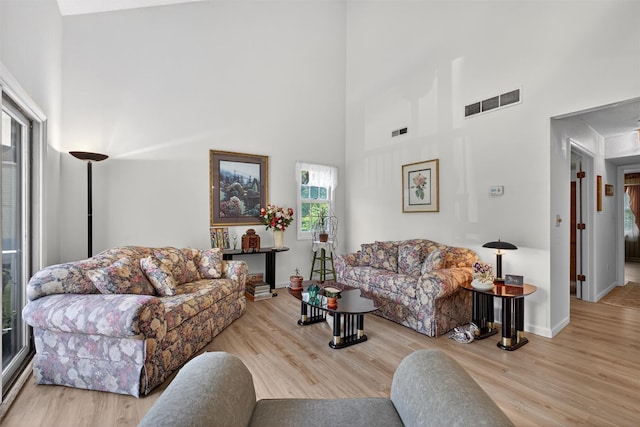 41 Millholland Dr, Fishkill, NY 12524 - living room featuring a high ceiling and wood finished floors