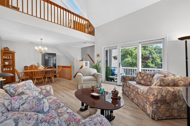 41 Millholland Dr, Fishkill, NY 12524 - living room featuring wood finished floors, a chandelier, and high vaulted ceiling