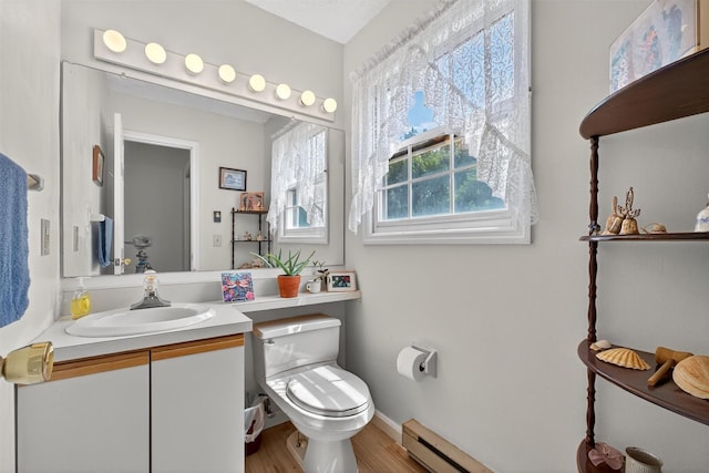 41 Millholland Dr, Fishkill, NY 12524 - half bath with vanity, wood finished floors, and baseboard heating