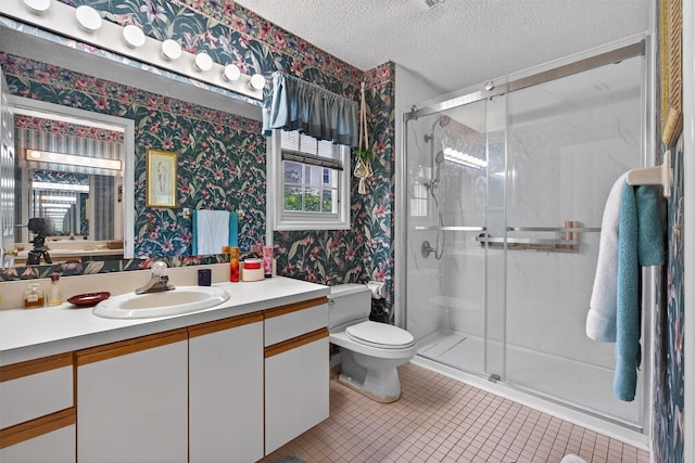 41 Millholland Dr, Fishkill, NY 12524 - bathroom with wallpapered walls, vanity, a textured ceiling, a stall shower, and tile patterned flooring