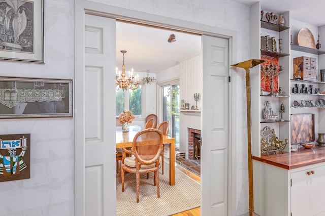 5 Shore Dr, Setauket, NY 11733 - dining room featuring a chandelier and light wood-type flooring