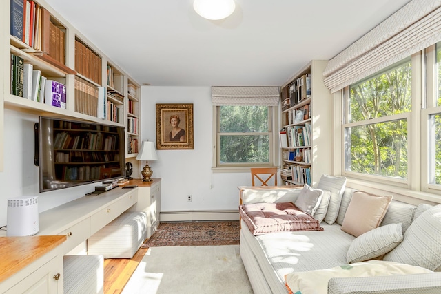 5 Shore Dr, Setauket, NY 11733 - living area featuring baseboard heating, an office area, light wood-style floors, and built in features