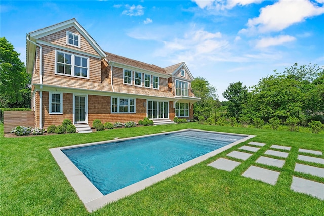 161 S Rd, Westhampton, NY 11977 - back of house with entry steps, an outdoor pool, and a yard