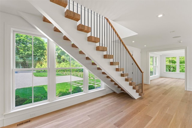 161 S Rd, Westhampton, NY 11977 - stairway with wood finished floors, healthy amount of natural light, and recessed lighting