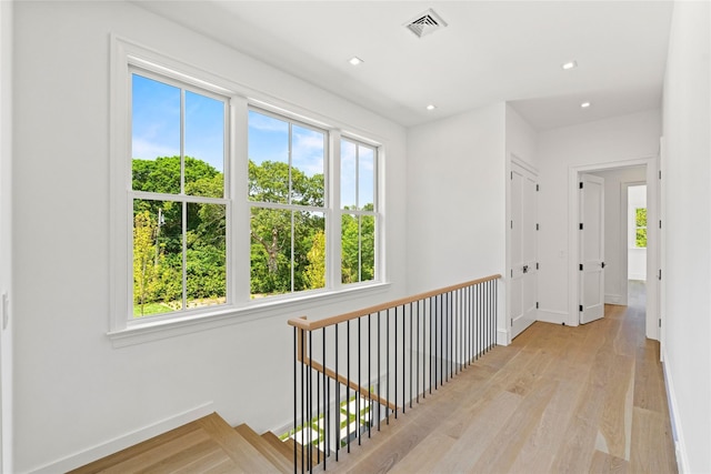 161 S Rd, Westhampton, NY 11977 - hall featuring plenty of natural light, light wood finished floors, an upstairs landing, and recessed lighting
