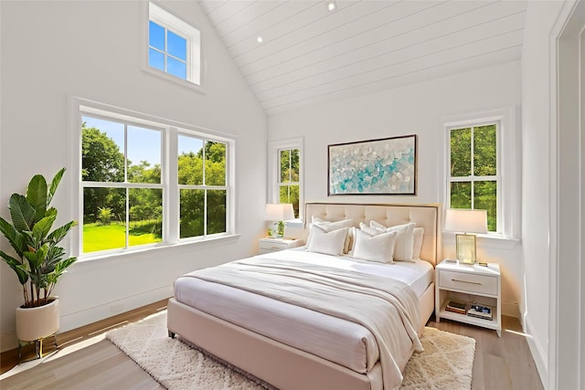 161 S Rd, Westhampton, NY 11977 - bedroom featuring wood finished floors and high vaulted ceiling