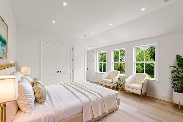 161 S Rd, Westhampton, NY 11977 - bedroom with light wood-style floors, vaulted ceiling, recessed lighting, and a closet