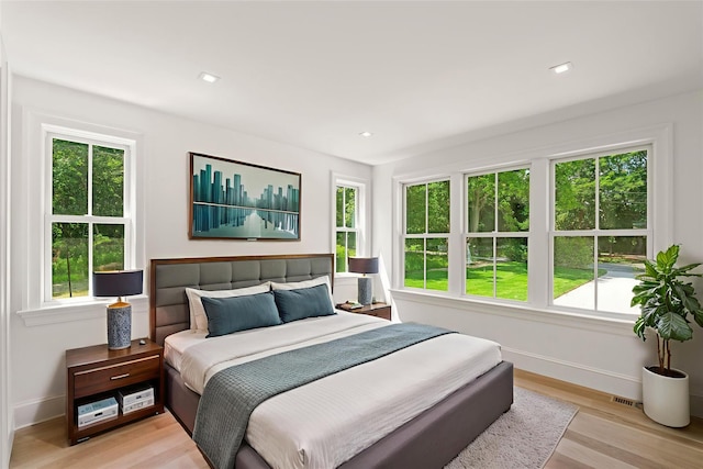 161 S Rd, Westhampton, NY 11977 - bedroom with multiple windows and light wood finished floors