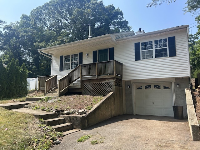 291 Locust Dr, Rocky Point, NY 11778 - view of front of house featuring covered porch, a garage, driveway, and stairs