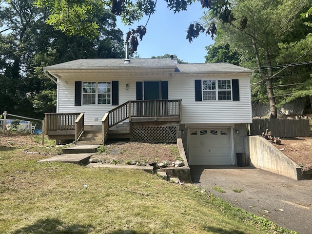 291 Locust Dr, Rocky Point, NY 11778 - view of front facade featuring an attached garage and driveway