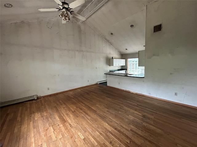 291 Locust Dr, Rocky Point, NY 11778 - unfurnished living room with hardwood / wood-style floors, lofted ceiling, a ceiling fan, and baseboard heating