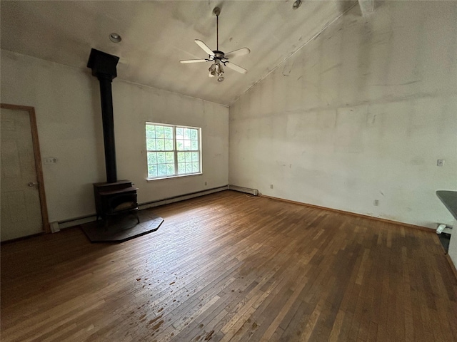 291 Locust Dr, Rocky Point, NY 11778 - unfurnished living room with a wood stove, wood-type flooring, a ceiling fan, baseboard heating, and a baseboard heating unit