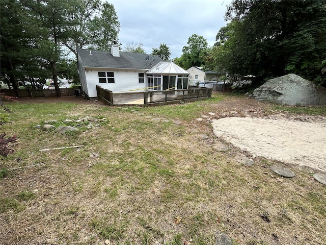 291 Locust Dr, Rocky Point, NY 11778 - rear view of house featuring a chimney and a deck