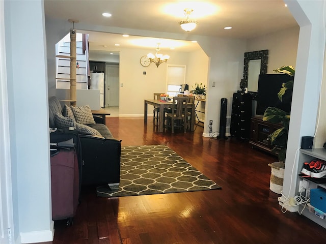 92-38 77th St, Woodhaven, NY 11421 - living room with arched walkways, wood finished floors, a chandelier, and recessed lighting