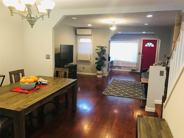 92-38 77th St, Woodhaven, NY 11421 - dining room featuring a chandelier, wood finished floors, a wall mounted air conditioner, recessed lighting, and arched walkways