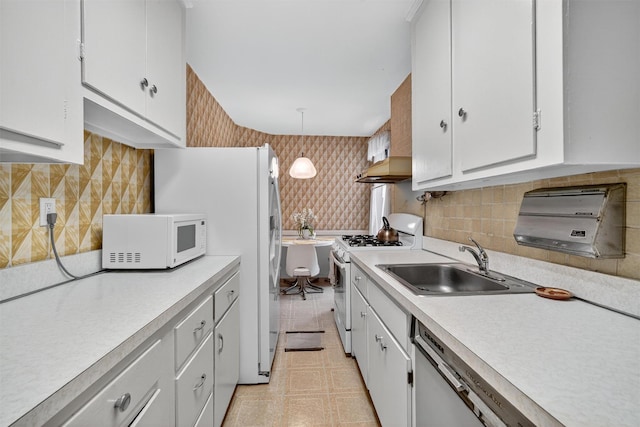 517 Riverdale Ave Unit 4A, Yonkers, NY 10705 - kitchen featuring white appliances, light countertops, white cabinetry, tasteful backsplash, and wallpapered walls