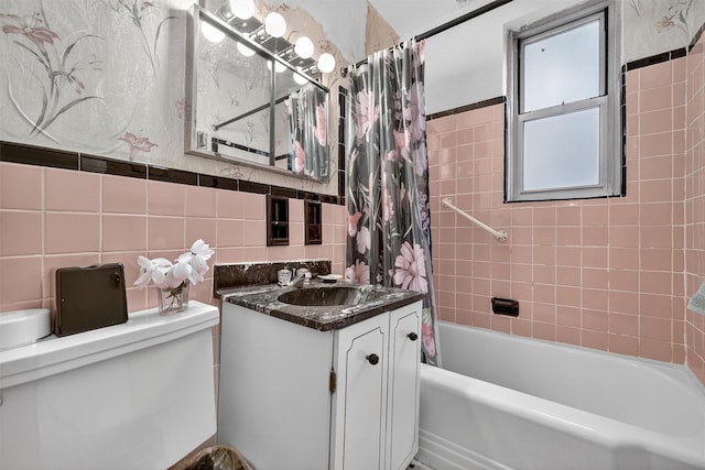 517 Riverdale Ave Unit 4A, Yonkers, NY 10705 - bathroom featuring tile walls, vanity, and shower / tub combo
