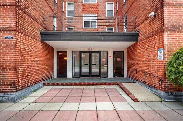 517 Riverdale Ave Unit 4A, Yonkers, NY 10705 - view of exterior entry with french doors, brick siding, and a balcony
