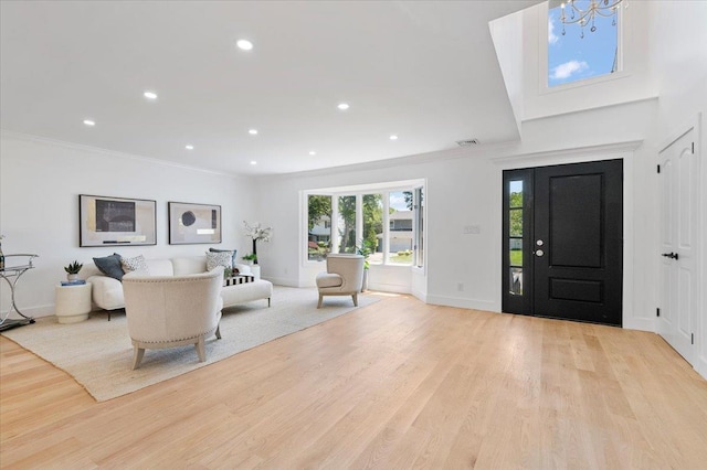 77 Bounty Ln, Jericho, NY 11753 - foyer featuring light wood-type flooring, ornamental molding, recessed lighting, and a chandelier
