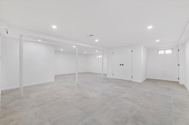 77 Bounty Ln, Jericho, NY 11753 - basement with recessed lighting and baseboards