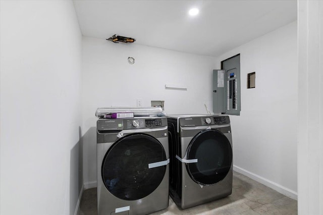 77 Bounty Ln, Jericho, NY 11753 - laundry room with electric panel and washer and clothes dryer