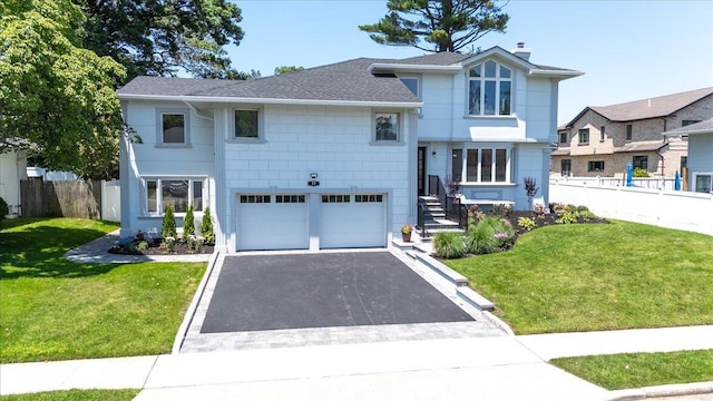 77 Bounty Ln, Jericho, NY 11753 - view of front facade featuring driveway, roof with shingles, a chimney, and a garage