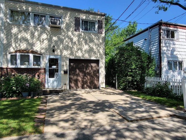 149-70 Wellers Ln, Rosedale, NY 11422 - view of front of property featuring a garage and concrete driveway