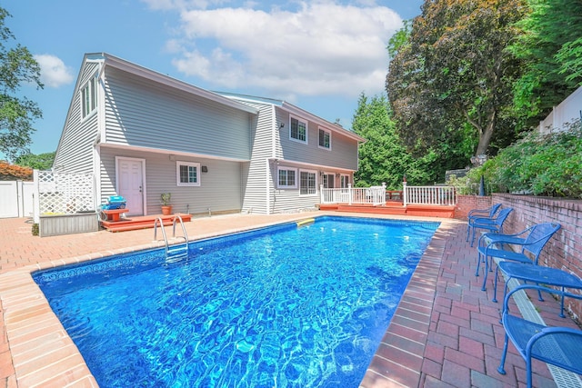239 Walnut Rd, Glen Cove, NY 11542 - view of pool with a wooden deck and a patio