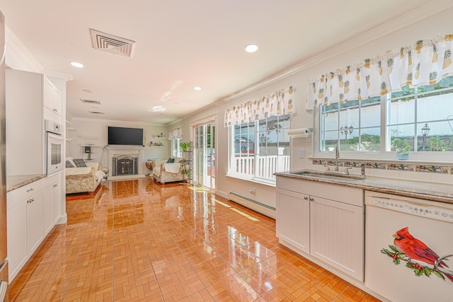 239 Walnut Rd, Glen Cove, NY 11542 - kitchen featuring white appliances, a baseboard radiator, crown molding, recessed lighting, and open floor plan