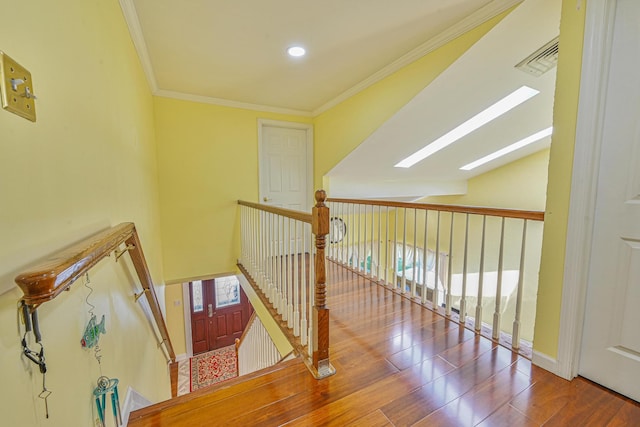 239 Walnut Rd, Glen Cove, NY 11542 - staircase with wood finished floors, ornamental molding, and recessed lighting