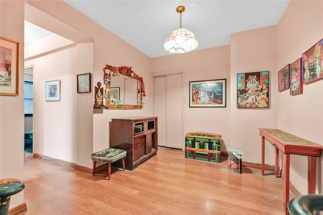 26-20 141st St Unit 2G, Flushing, NY 11354 - rec room featuring wood finished floors and a chandelier