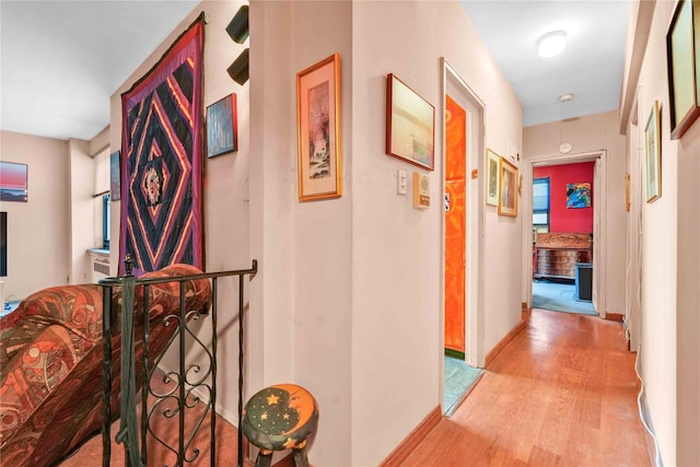 26-20 141st St Unit 2G, Flushing, NY 11354 - hallway featuring light wood-style floors and baseboards