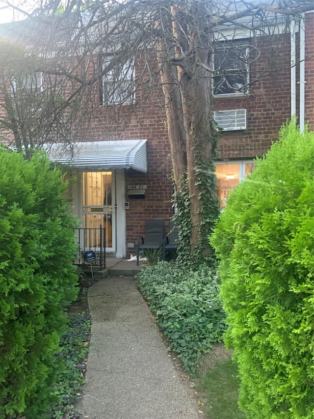 14451 68th Ave, Kew Garden Hills, NY 11367 - view of exterior entry featuring brick siding
