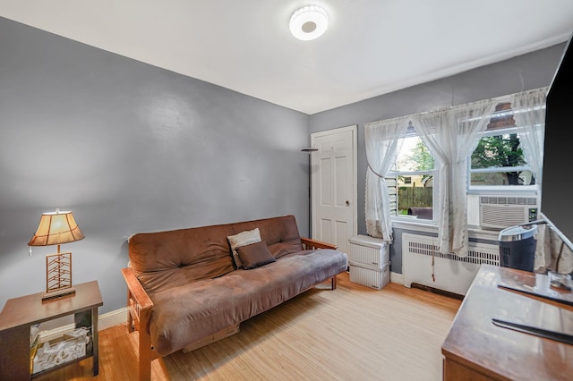 662 Rose Blvd, Baldwin, NY 11510 - home office featuring radiator heating unit, wood finished floors, and cooling unit