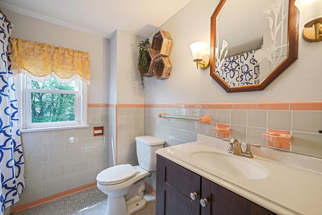 662 Rose Blvd, Baldwin, NY 11510 - bathroom featuring tile walls, vanity, wainscoting, and tile patterned flooring