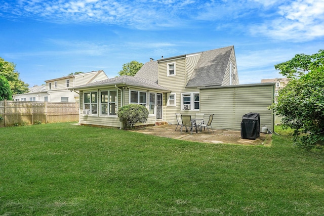 662 Rose Blvd, Baldwin, NY 11510 - back of property with a shingled roof, a sunroom, and a patio area