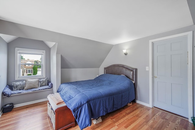 662 Rose Blvd, Baldwin, NY 11510 - bedroom with wood finished floors and lofted ceiling