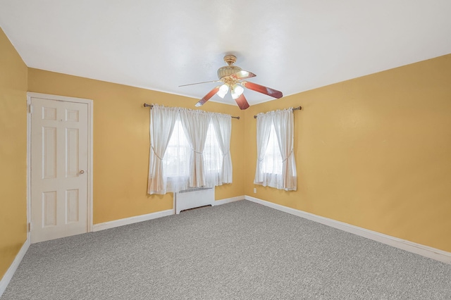 662 Rose Blvd, Baldwin, NY 11510 - carpeted empty room featuring radiator and a ceiling fan