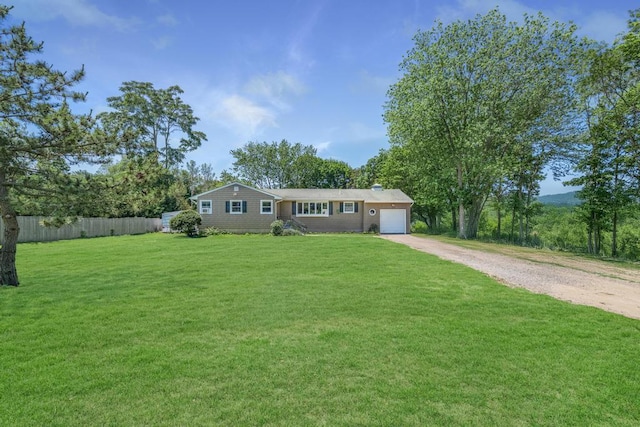 565 Barley Ln, Southold, NY 11971 - single story home with dirt driveway and a garage
