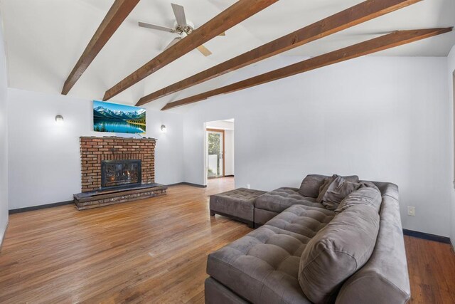 565 Barley Ln, Southold, NY 11971 - living area with ceiling fan, a fireplace, and wood finished floors