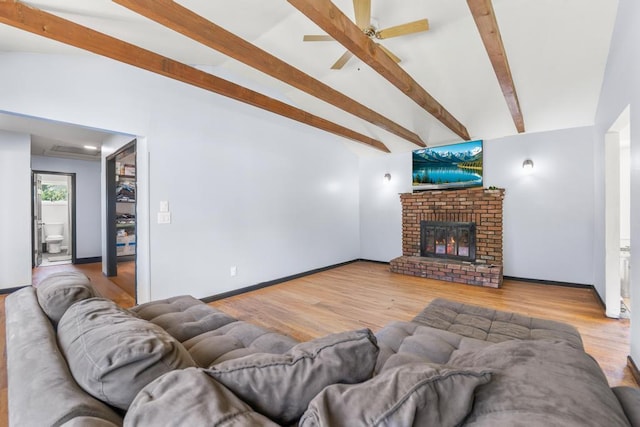 565 Barley Ln, Southold, NY 11971 - living room with wood finished floors, a brick fireplace, and ceiling fan