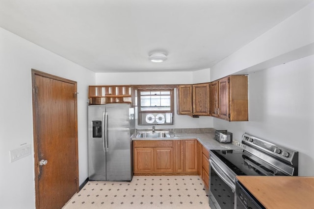 565 Barley Ln, Southold, NY 11971 - kitchen featuring stainless steel appliances, light countertops, open shelves, and brown cabinets