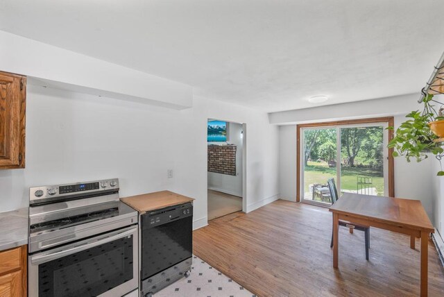 565 Barley Ln, Southold, NY 11971 - kitchen featuring stainless steel range with electric cooktop, dishwasher, light wood-type flooring, and light countertops