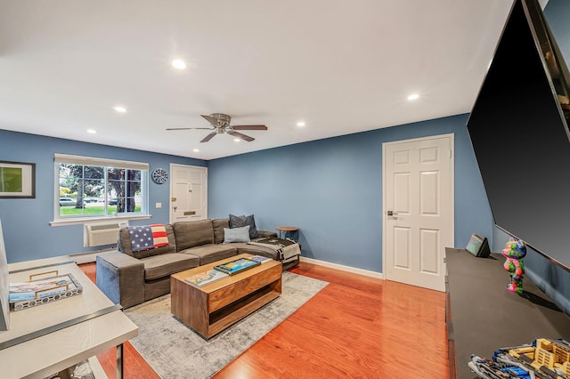 114 Jervis Ave Unit 114, Farmingdale, NY 11735 - living area with recessed lighting, light wood-style flooring, a ceiling fan, baseboard heating, and a wall unit AC