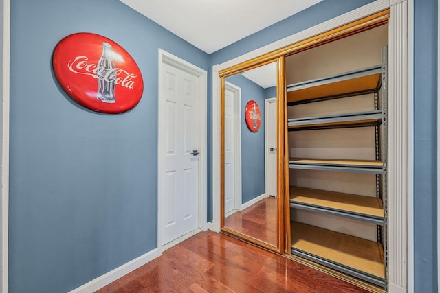 114 Jervis Ave Unit 114, Farmingdale, NY 11735 - corridor with wood finished floors and baseboards