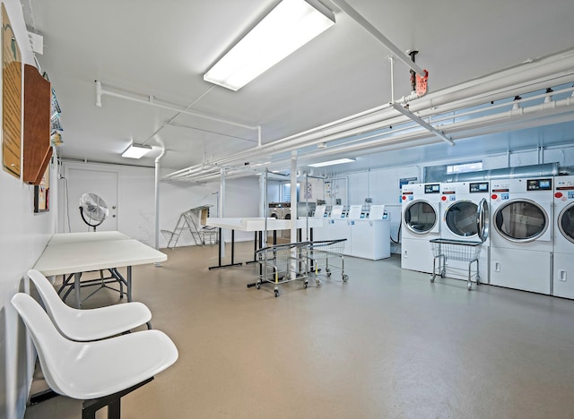 114 Jervis Ave Unit 114, Farmingdale, NY 11735 - miscellaneous room featuring separate washer and dryer and finished concrete flooring